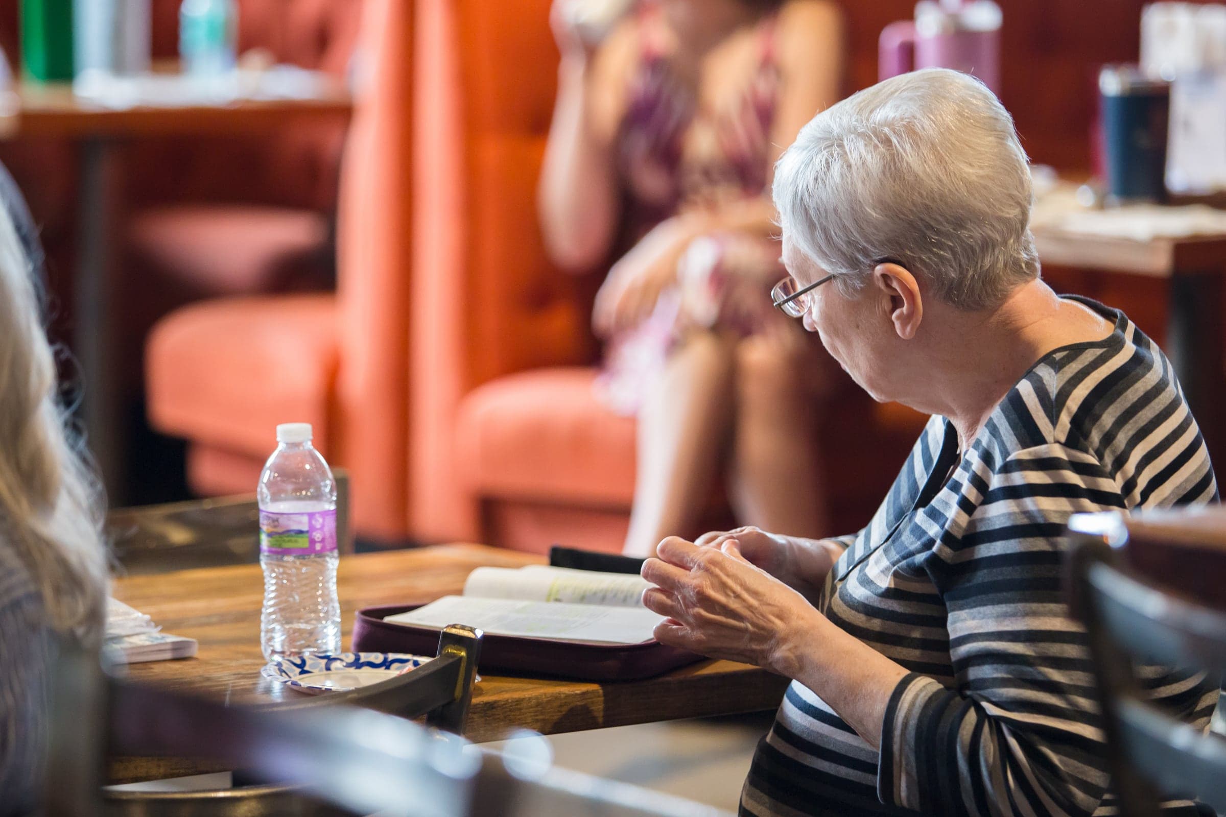 A member reading and reflecting around the table